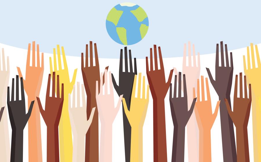Colorful hands reaching up as a group toward a globe